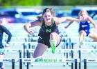 NHS Ladycat Camren Mallory was a dominant force in hurdles.