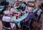 Edwana Fikes sits with her husband, Wade, at a celebration of her longtime service to the Olney Senior Cub Center on July 11. Photo by Will Sadler