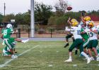 Caption: NHS Bobcat #18 Keyton Newland, RB/QB, has one of the best legs in the district and kicks bombs through the uprights, rarely missing his mark.
