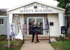 Olney Police Chief Dan Birbeck welcomes the community to the dedication of the Perry Public Safety Building at a May 19 ceremony at 210 S. Grand Ave. Photo by Will Sadler