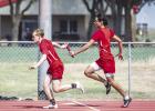 The 4x1 relay second place team consisted of Kyle Stewart, Juan Castillo, David McCarson and Domonique Collins. Shown: Juan Casteel passes the baton to OHS teammate David McCarson. Photo by Will Sadler