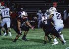 The Olney High School Cubs showed their mettle in their homecoming game at Cub Stadium on Oct. 3 with a 33-0 rout of the Crosbyton Chiefs. Here, OHS Cub Ricco Sandoval (55) showed he could run as well as guarding the quarterback and making running plays a