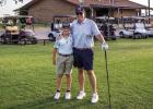 The Olney Country Club’s Parent-Child Golf Tournament on July 11 drew 37 teams for a day of play, prizes and lunch. (Left): Granddad Todd Betts was proud to spend the day golfing with grandson Logan.(Right): Preston Rowe and son Zachary attended the ORA