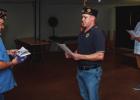 The Olney American Legion Post 414 performed a flag retirement ceremony on Sunday evening. The ceremony includes a flag inspection and prayer shown here. City Councilmember and Legion Chaplain Steven Nurre, Post Vice Commander Eric Loggins, and Post Comma