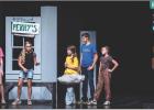 A group of teenagers hanging out on Main Street, awaiting the drag race. Photo by Will Sadler
