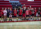 The second through fourth graders showed up in force for Coach Symank’s summer basketball skills camp. Photo by Will Sadler