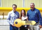 Air Tractor President Jim Hirsch (Right) hands over the key to the company’s 5,000th aircraft to Adriano and Daisy Prediger at a celebration in Olney on May 28. Photo by Will Sadler