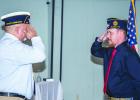 Former American Legion Post 414 Commander and District Commander Chris Garcia swears in new Olney Post 414 Commander Eric Loggins. Photo by Will Sadler