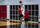 An older Cub camper goes for a lay up after travelling the length of the court at full speed. Photo by Will Sadler