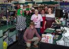Stewart’s Food Store proprietor Robert Stewart (kneeling) poses with employees at the store’s 50th anniversary celebration on Nov. 1 Photo by Will Sadler