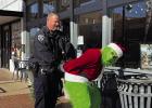 Olney Police Chief Bryan Barrett put the cuffs outside Hometown Coffee &amp; Tea on Main Street on Dec. 22. The Grinch had been seen around town for days in multiple locations, threatening to ruin Christmas. The OPD got their man - er, Grinch -- just in t
