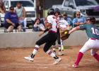 During a missed catch by the Lady Heat catcher, a Lady Cub sprinted across the plate just missing being tagged out. Photo by Will Sadler