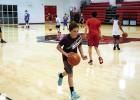 New basketball coach hosts
