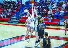 OHS Lady Cub #20 Natalie Simmons performs the tip-off and scored 7 points for the night, including a 3-point bomb from outside the line. Photo by Will Sadler