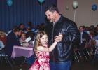 Proud fathers escorted their daughters onto the dance floor to tunes spun by DJ Rad Dad Chris Garcia to create magical memories. Olney Coach Casey Keeter dances with his daughter Addi in the pastel wonderland created by volunteers at the Olney Civic Cente
