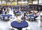 Air Tractor employees and local leaders enjoy a luncheon at the Air Tractor plant in Olney to celebrate the company’s completion of its 5,000th aircraft on May 28. Photo by Will Sadler