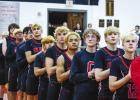 All high school varsity games start as they should - with a prayer and paying respect to the country and flag. Photo by Will Sadler