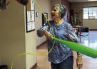 Becky Brewer takes a swing at the pinata at the Olney-Young County Senior Cub Center’s Cinco de Mayo celebration on May 5. Photo by Candy Blair