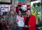 Shane and Cindi Bivins received a special certificate of recognition for being open for 1 year in Olney from Olney Chamber Director Kimberly Smith Photo by Will Sadler