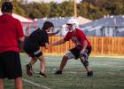 Cub defense backs practice reading quarterback calls and tackling running backs. Photo by Will Sadler