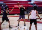 Cub Basketball Coach Eric Symank was able to have some fun during open gym night, giving student athletes a little lesson under the hoops. Photo by Will Sadler
