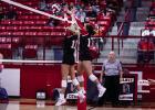 Lady Cubs block at the net during district matchup with the Lady Trojans. Photo by Will Sadler