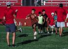 Camp attendees start each day with warm-ups, which will keep injuries and muscle spasms to a minimum. Photo by Will Sadler