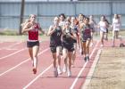 Second and third place finishers in the 800m, NHS Allison Melton [front] and Greenleigh Moore [right]. The runners finished in the same order in the 1600m. Photo by Will Sadler