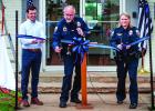 Mayor Rue Rogers, Police Chief Dan Birbeck and Police Det. Autumn Thames cut the ribbon to open the new Public Safety Building at 210 S. Grand Ave. Photo by Will Sadler