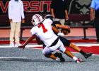 Cub #7 Damian Hernandez LB-WR sacks the Eagles QB, one of 4 sacks for the night. Hernandez had the QB scrambling all night and it was a big factor in the Cubs district win. Photo by Will Sadler