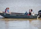 Wes Dutter with Texas Parks & Wildlife offered boat rides around the lake, while other students enjoyed skipping rocks on the lake while chatting.