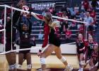 Photo by Will Sadler Lady Cub #3 Bradi Bowers slams a kill past two Lady Panther defenders.