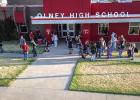 Olney High School Students wait for the first bell of the new school year to ring. Photo by Will Sadler