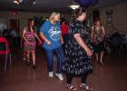 Attendees of the Cub Centers Summer Dance enjoying line dancing during the evening of fun. Photo by Will Sadler
