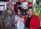 Shane and Cindi Bivins received a special certificate of recognition for being open for one year in Olney from Olney Chamber Director Kimberly Smith Photo by Will Sadler