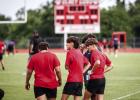 Varsity Cubs anxiously wait their turn to take the field during the Munday touch football game. Photo by Will Sadler
