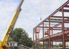 A crane lifts the final beam into place at the First Baptist Church of Olney’s new education building. The 17,300 square foot building will be completed in the first quarter of 2027. Photo by Gina Keating