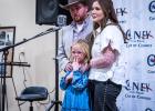 Raylee Cawthon stands with her parents, Ryan and Malia Cawthon, after receiving the Olney Chamber’s award for Volunteer of the Year. Photo by Will Sadler