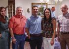 Julie Nawrocki, director of philanthropy for the Wichita Falls Area Food Bank, stands with United Methodist Pastor Harrell Braddock, Olney Mayor Rue Rogers, Anna Rogers, and Food Bank CEO David O’Neil at a reception to inform Olney residents about the F
