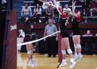 Lady Cub defenders #20 Natalie Simmons and #12 Morgan Simmons guard at the net with a successful block against Lady Panther hitters. Photo by Will Sadler