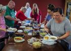 Attendees of the Cub Center July game night enjoyed delicious homemade dishes and good conversation before breaking off into smaller groups to play games. Photo by Will Sadler