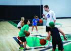 Coach Lane Dollar made sure the children attending his basketball camp not only learned valuable skills but also how to have fun during the process. Photo by Will Sadler