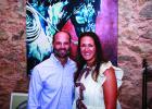 Olney’s newest artist Christen Horner [L] with Olney’s newest physician and husband Dr. John Horner during a reception held for the artist at Archer &amp; Gunn Mercantile. Photo by Will Sadler