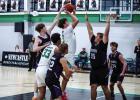 Bobcat #21 Jayden Hemby drives through Greyhound defenders and launches a floater. Photo by Will Sadler