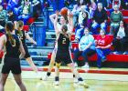 OHS Lady Cubs #10 Kristen Fields and #23 Aubree Englishbee team up against a Ladycat shooter. Photo by Will Sadler