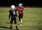 Cub Midget #5 Ace Cadotte checks with a sideline official to make sure he was lined up onsides before the snap. Photo by Will Sadler