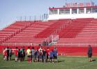 OISD Athletic Director and Head Football Coach Dustin Altmiller goes over camp expectations with attendees of the K-5 grade camp and instills excitement in the day’s activities. Photo by Will Sadler