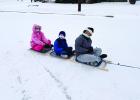 Aubree, Cayleb and Scarlett on their homemade sled