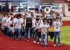 The OHS POOHS march onto Cub Field, heralding the start of Friday Night Lights where the Cubs would battle the Pirates. Photo by Will Sadler