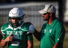 Words of encouragement come from Coach Isiah Archer to a young Bobcat player. Photo by Will Sadler